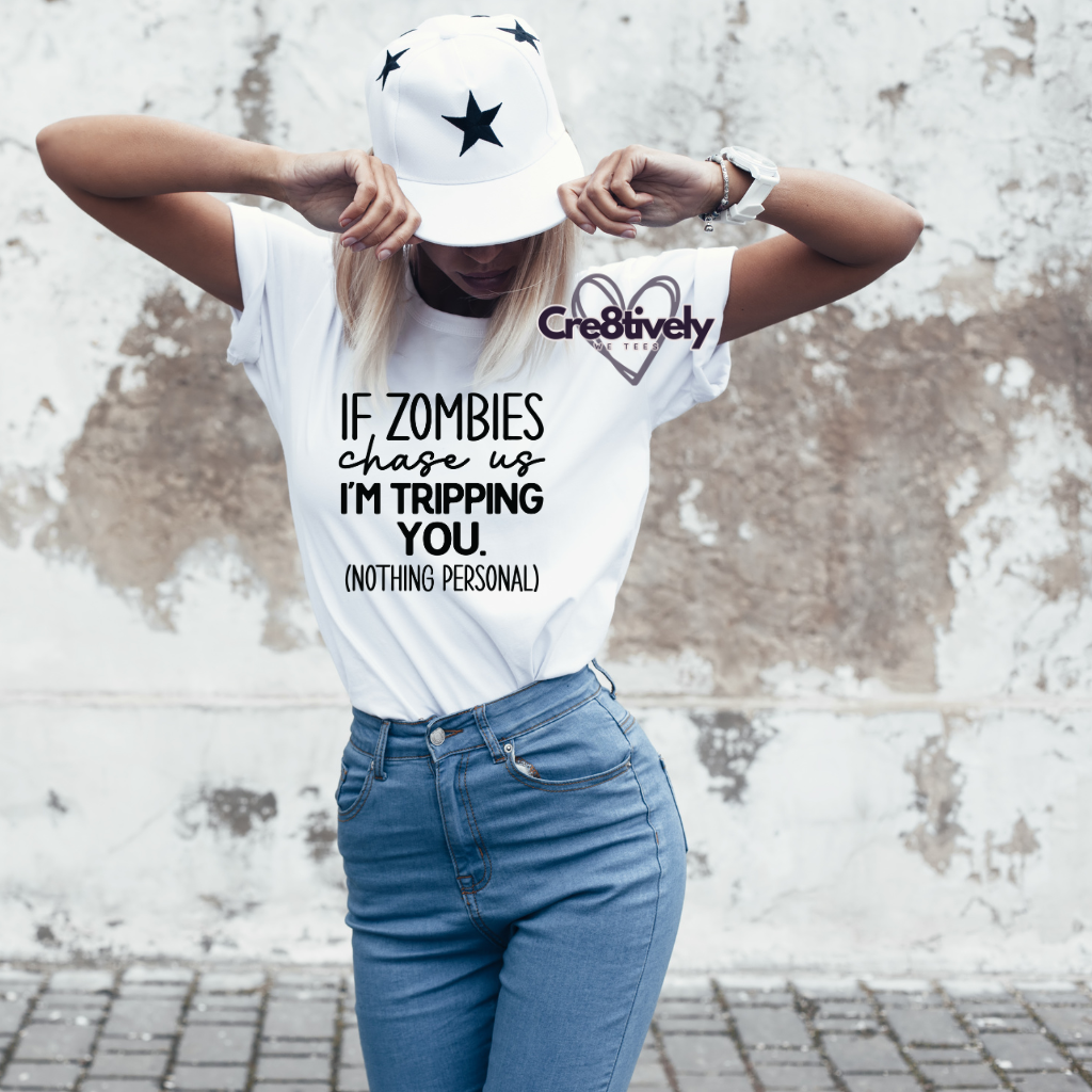 White T-shirt with quirky saying "If Zombies chase us I'm Tripping You. (Nothing Personal)"