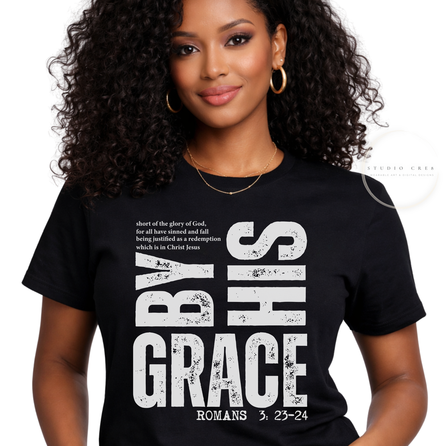 Woman wearing a black t-shirt with white text design on a plain background